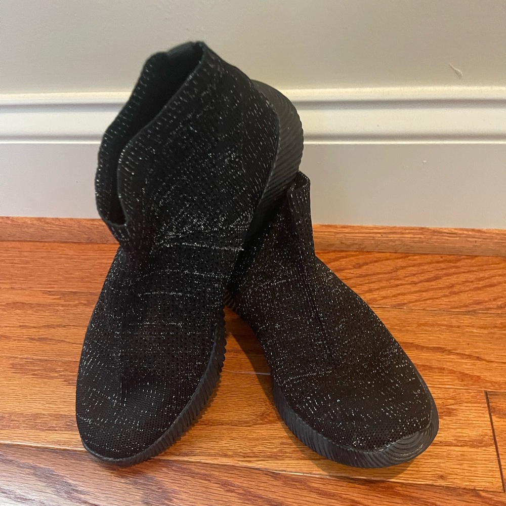 Black shiny slip on sneakers